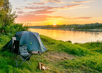 Camping tent in a camping in a forest by the river