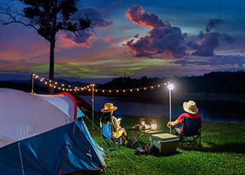 Couple tourists enjoying camping by the lake.